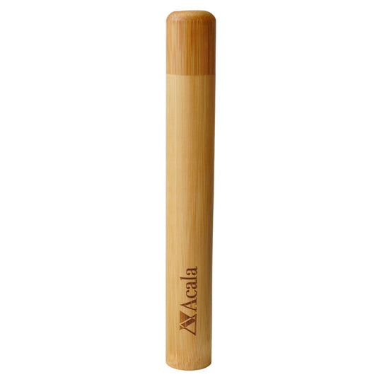 travel toothbrush case made out of bamboo wood standing upright. You can see the lid that is also bamboo and blends in with the design and the acala zero waste brand's logo etched into the wood at the bottom of the tubular case