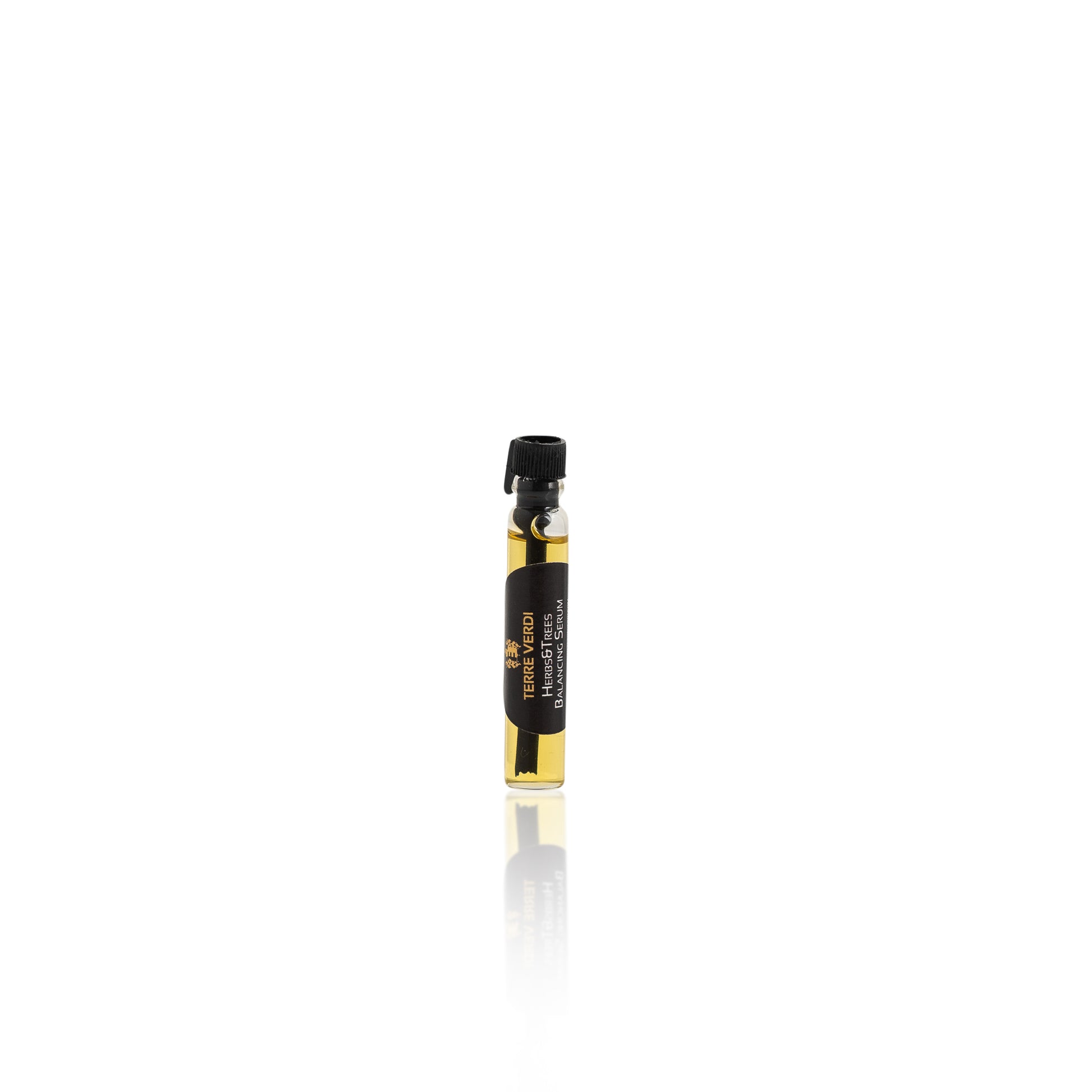 small vial of oil based organic serum with a black lid