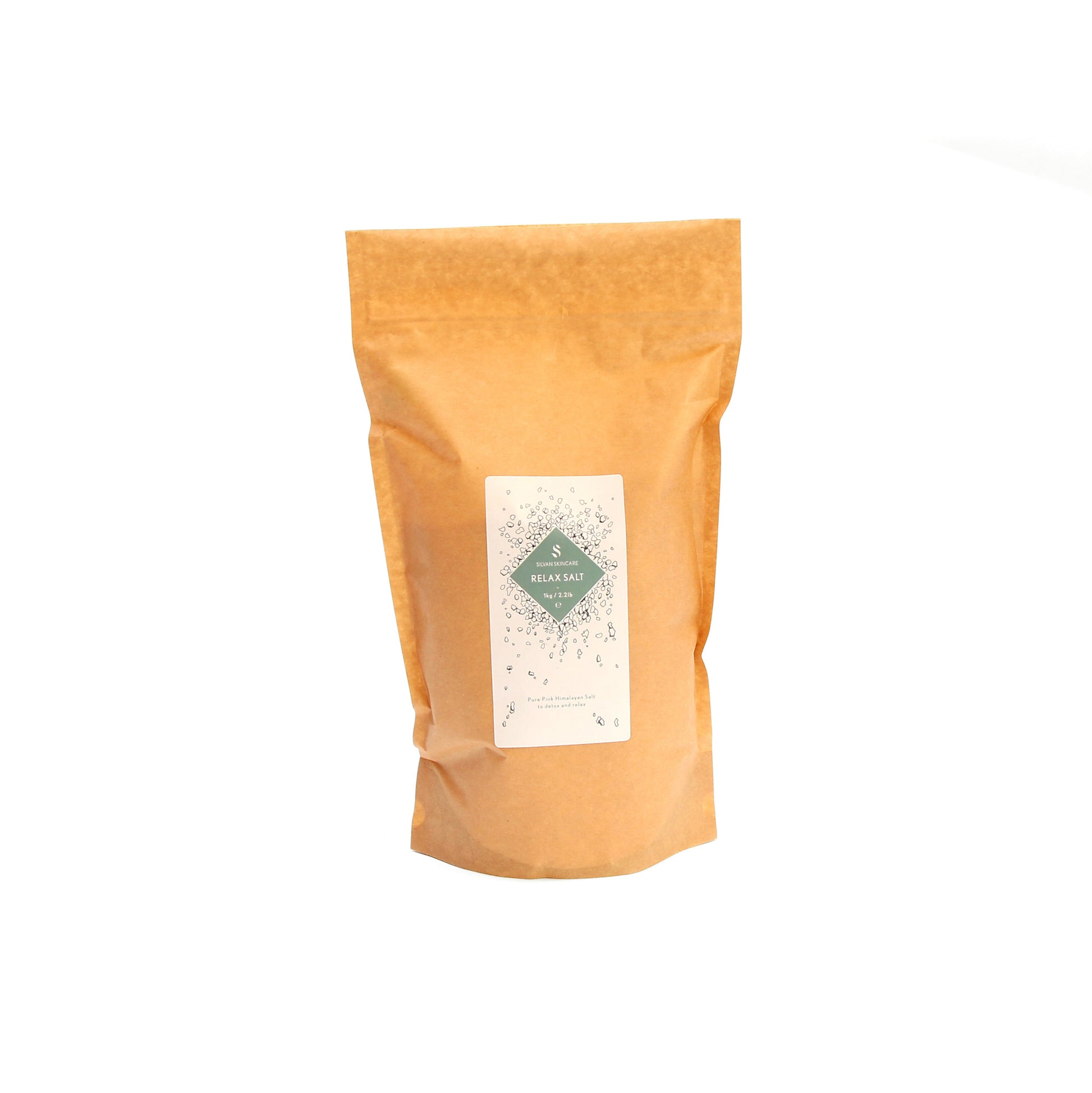 A brown bag of the relax salt of the skin salt on a white background. It has a white label and a teal diamond in the middle, listing the product and brand name.