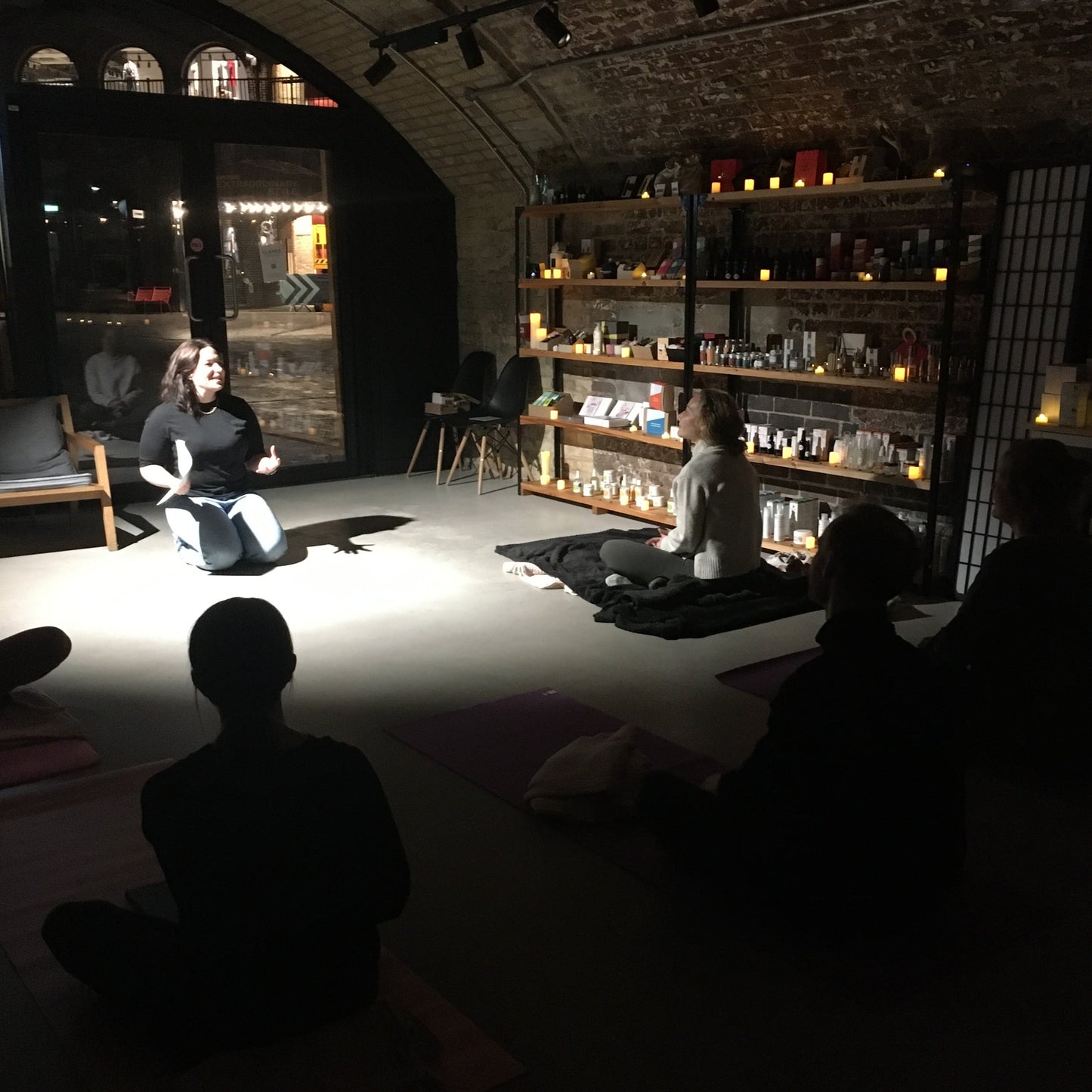 blomma beauty's coal drops yard store lit up by candlelight during meditation event