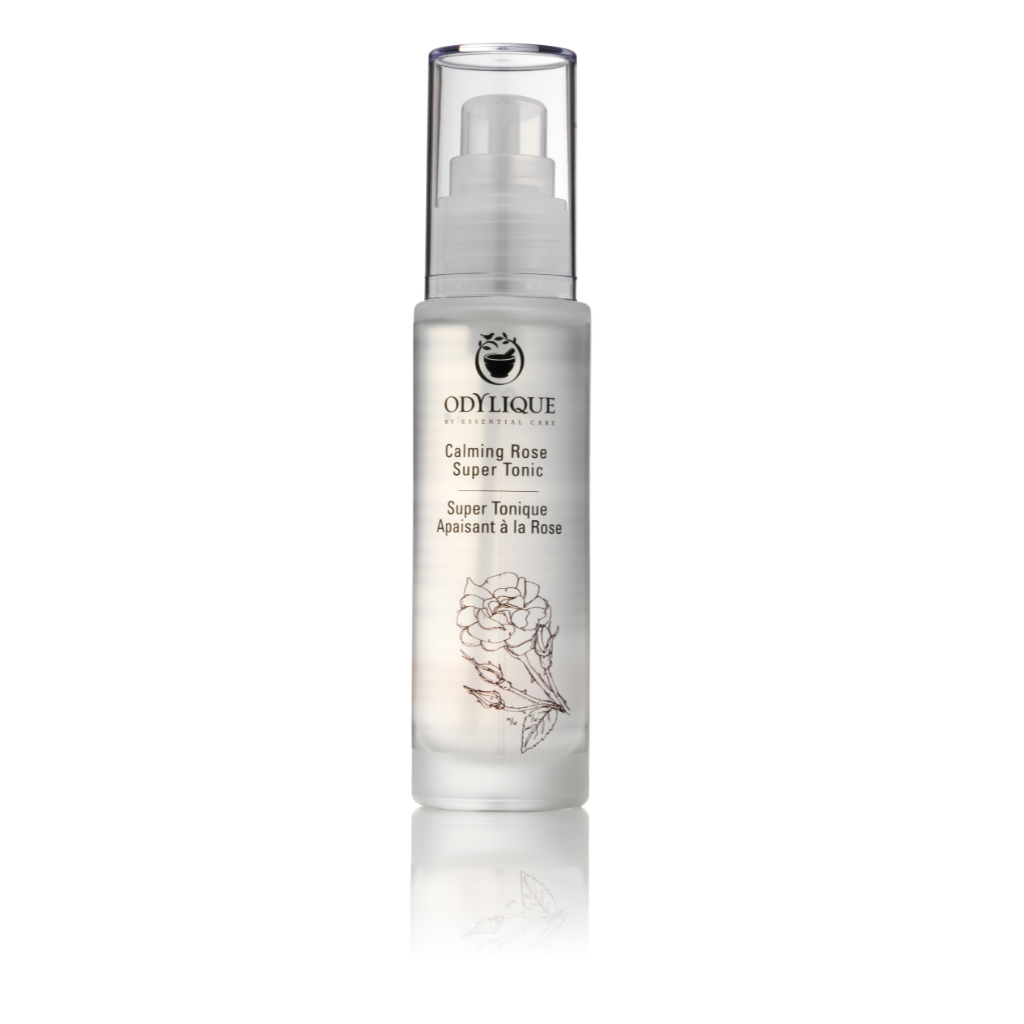 odylique calming rose super tonic in a clear glass bottle with a clear plastic pump and lid on a white background