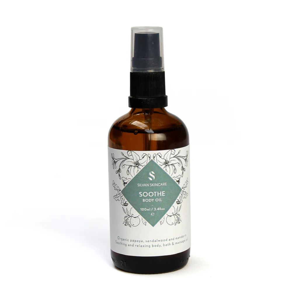 Silvan Skincare Soothe Body oil in an amber glass bottle with a white label and a turquoise diamond in the centre, listening the product name and brand in white text.