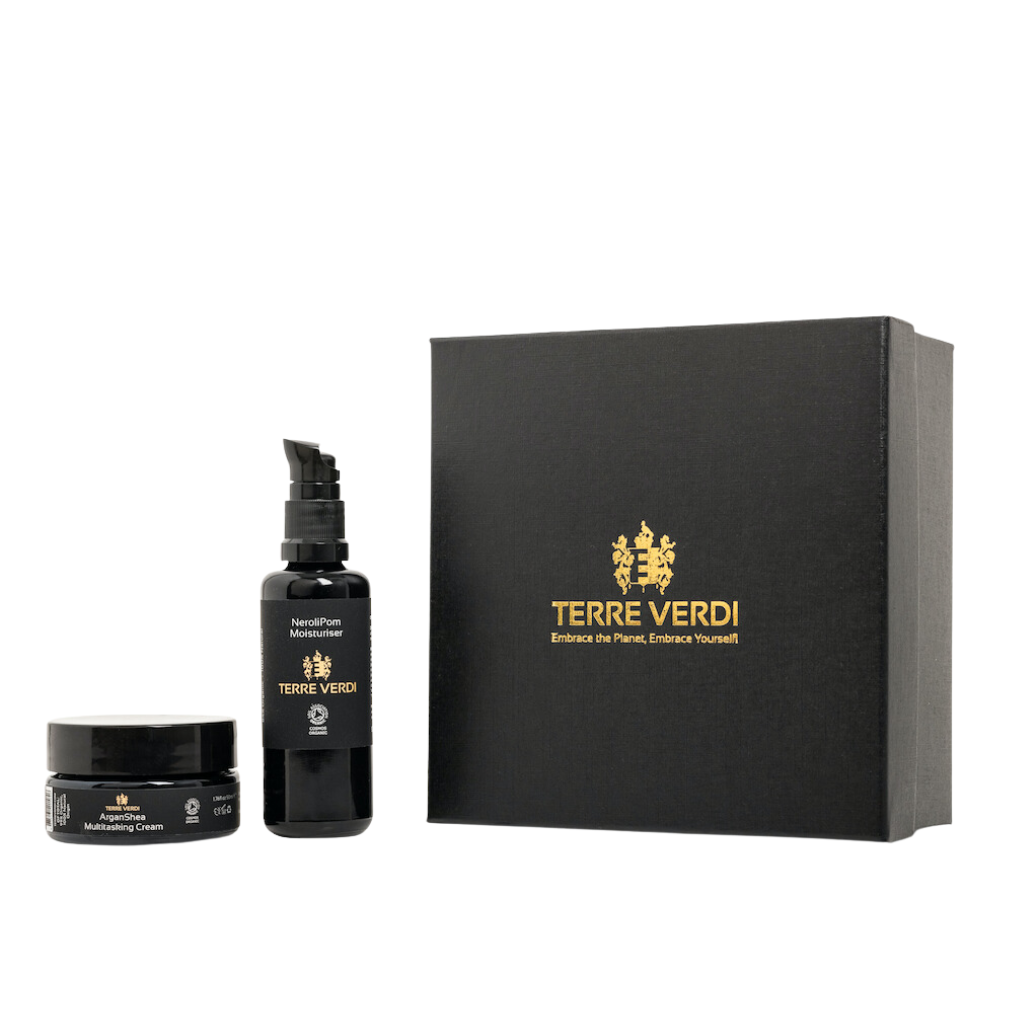 Terre Verdi Self Care Gift Set. Certified organic skincare gift set. Both products are in black bottles and stand next to a luxury black box embossed in gold with the Terre Verdi logo.