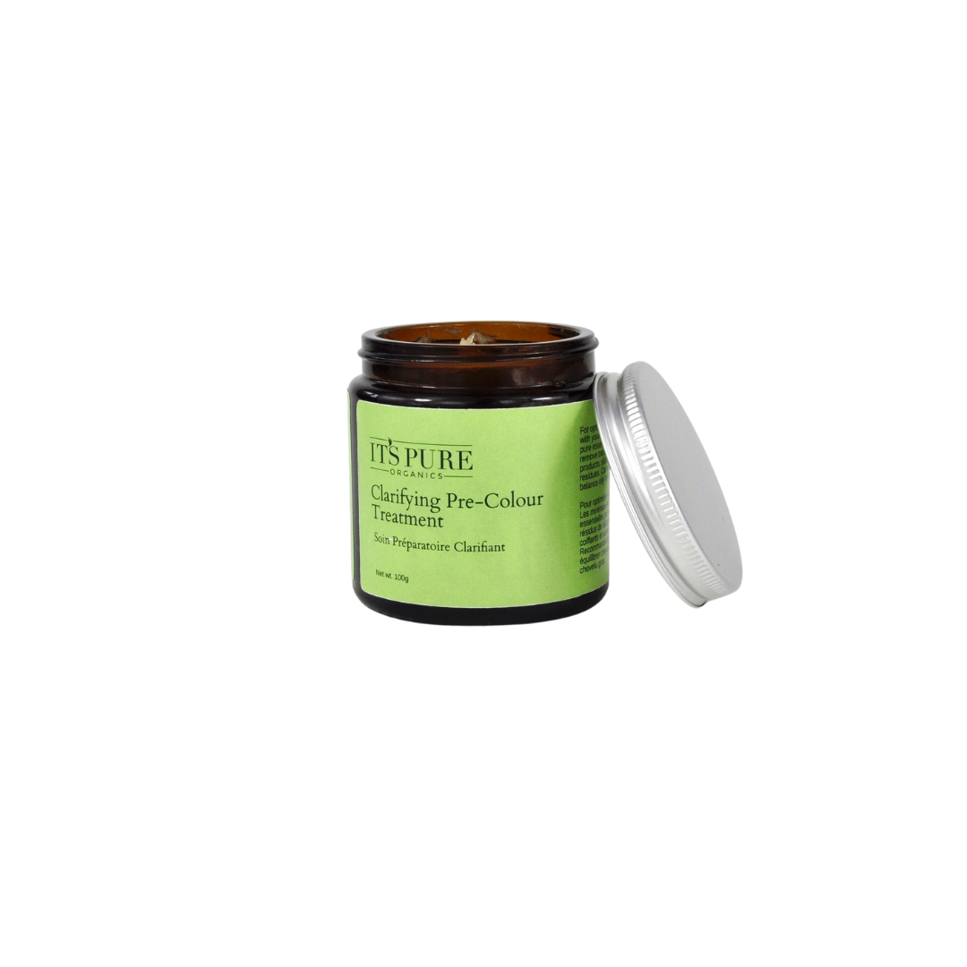 Amber glass jar of the It’s Pure Clarifying Pre-Colour Treatment with the aluminium lid resting beside it. The product label a light green with dark green text.
