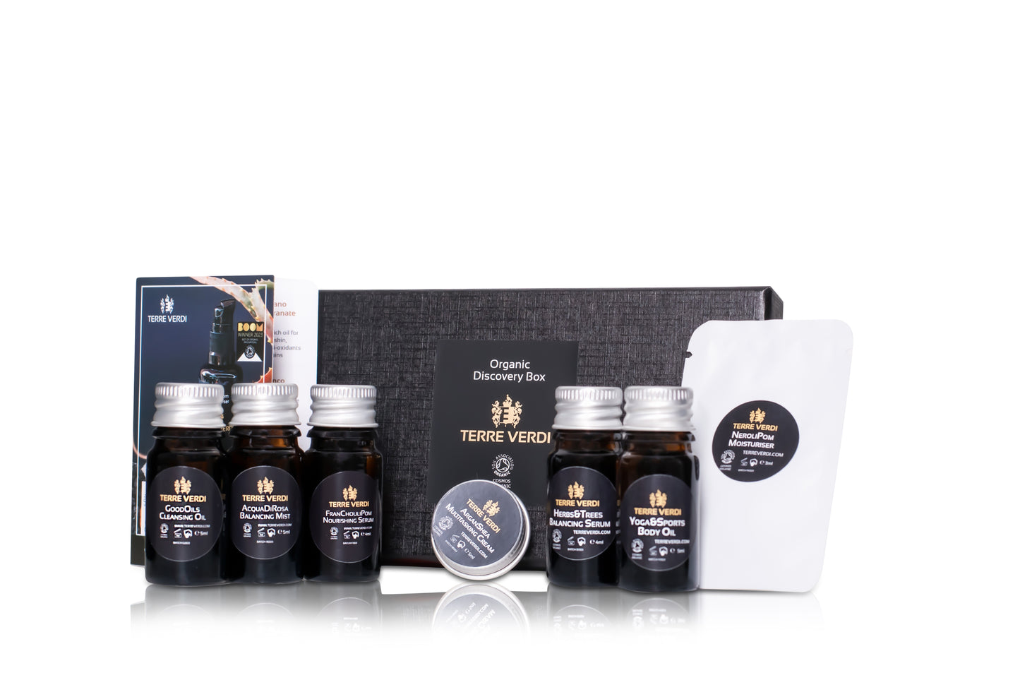 luxurious black gift box filled with miniature organic skincare samples to try in amber glass bottles with aluminium lids