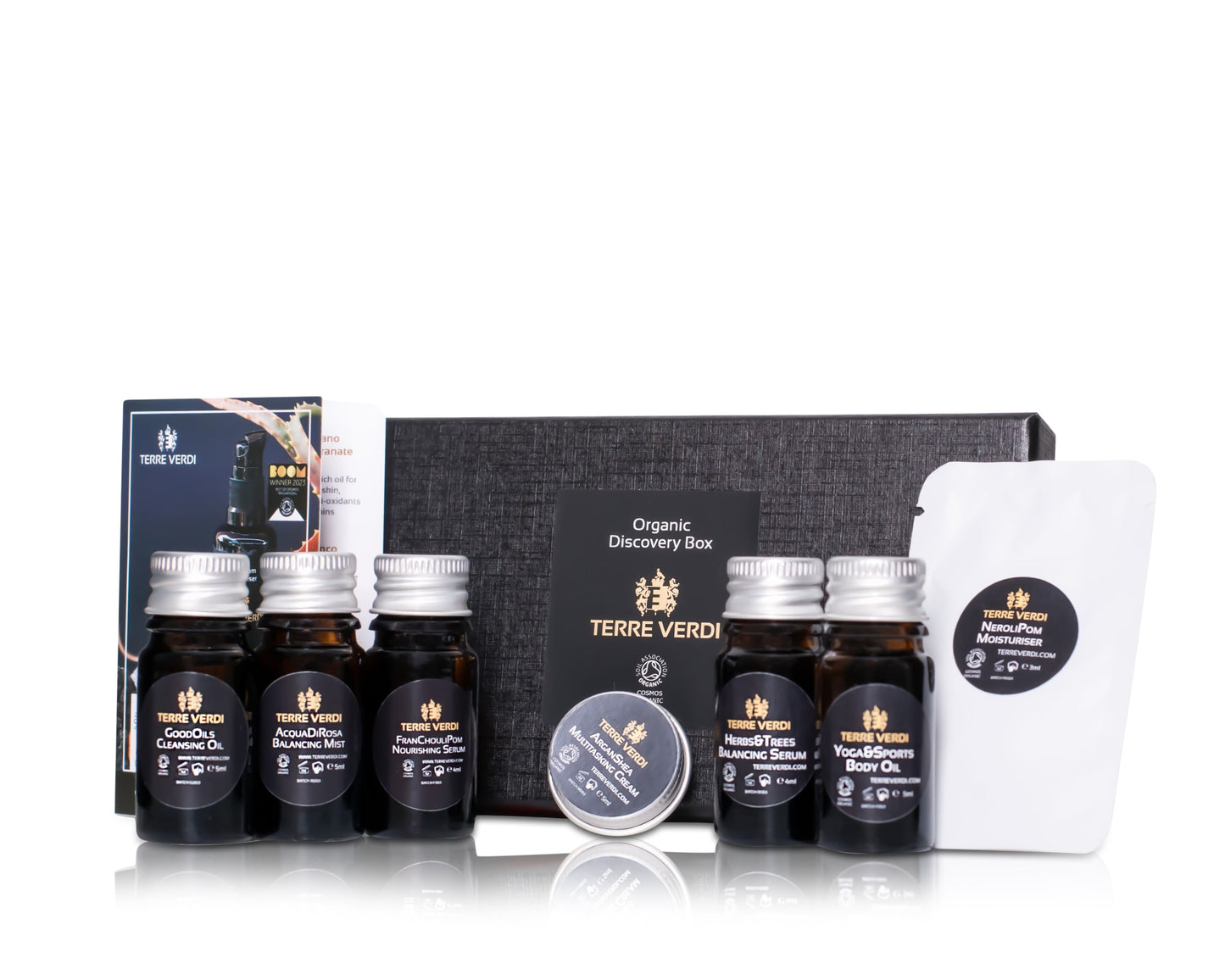 luxurious black gift box filled with miniature organic skincare samples to try in amber glass bottles with aluminium lids
