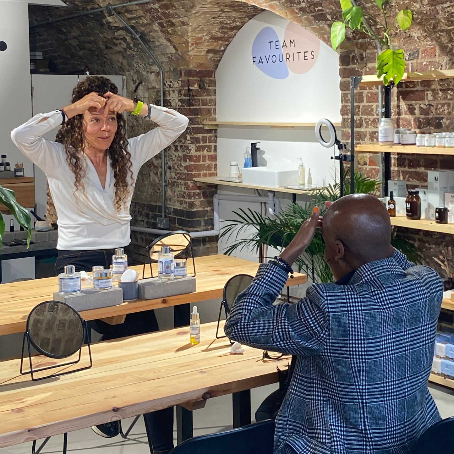 lucia from casa mencarelli skincare teaching face massage techniques at the blomma beauty natural skincare store in london