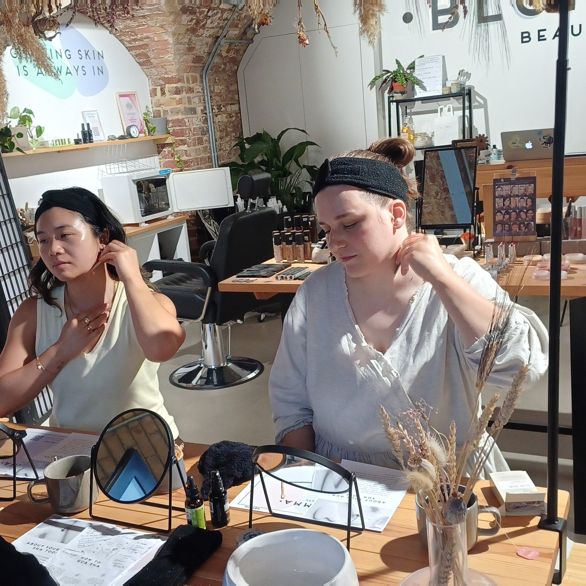 learning the correct angle and technique for using a gua sha tool in person at a workshop in london