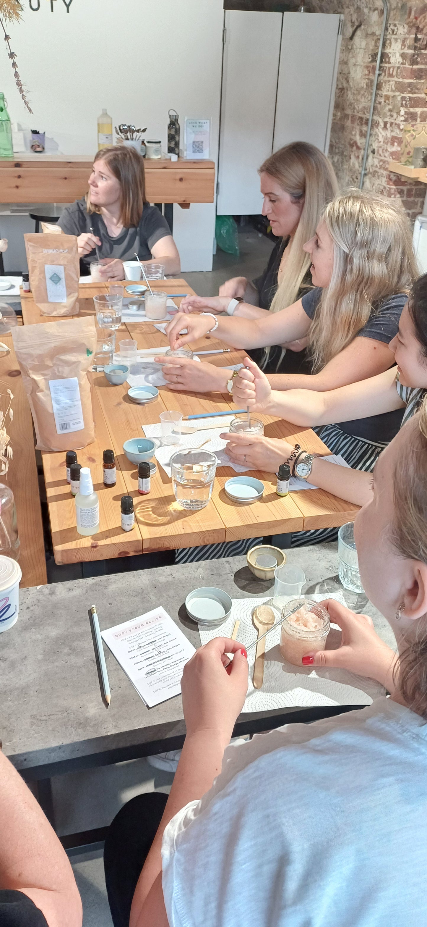 group of hen party guests at a bath salt making experience in london