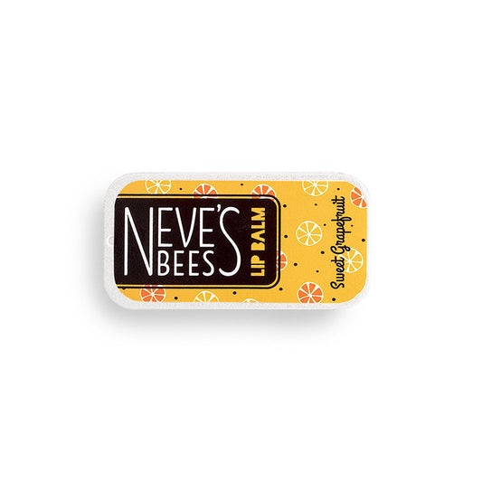 photo of a flat rectangular aluminium tin filled with sweet grapefruit beeswax lip balm. the tin has an orange yellow label and yellow and orange grapefruits drawn on it.