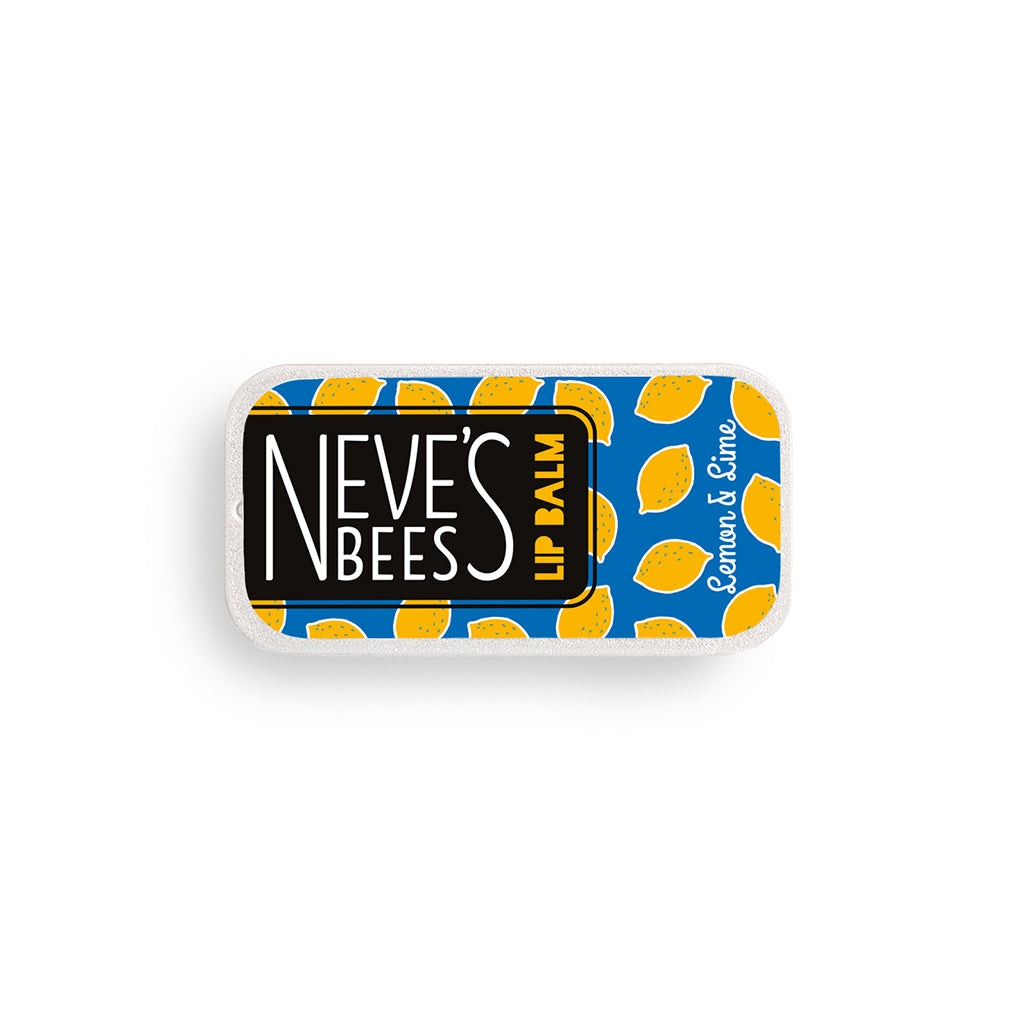 photo of a flat rectangular aluminium tin filled with lemon lime beeswax lip balm. the tin has a dark blue label with yellow lemons drawn on it.