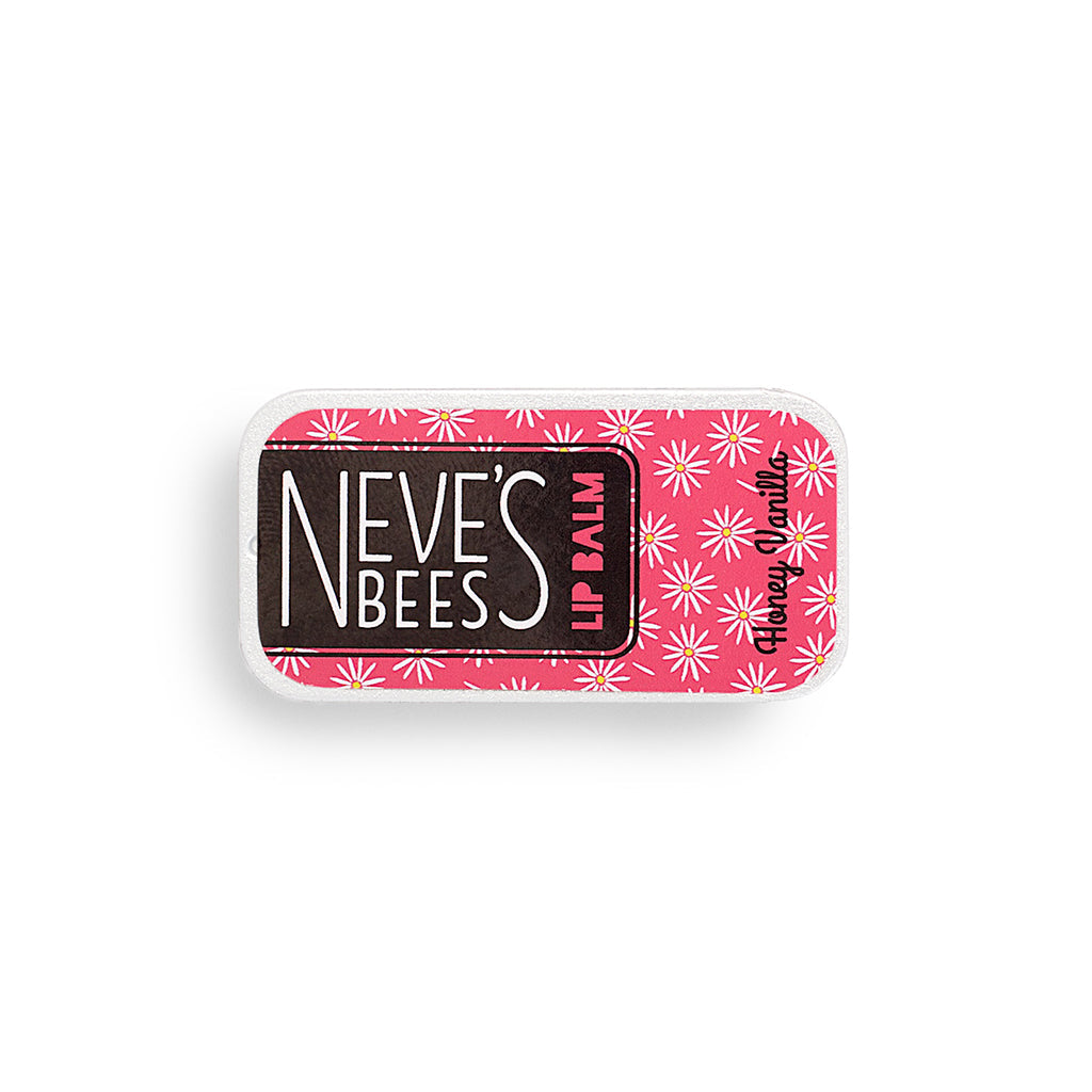 photo of a flat rectangular aluminium tin filled with honey vanilla beeswax lip balm. the tin has a pink label with white daisies drawn on it.