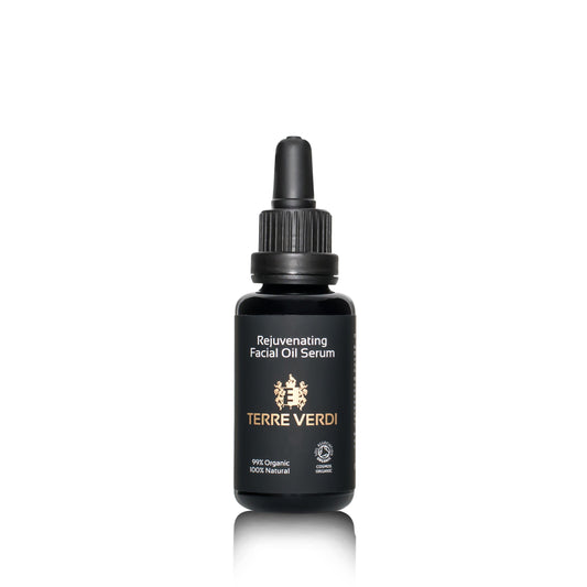 organic facial oil in a black bottle with pipette
