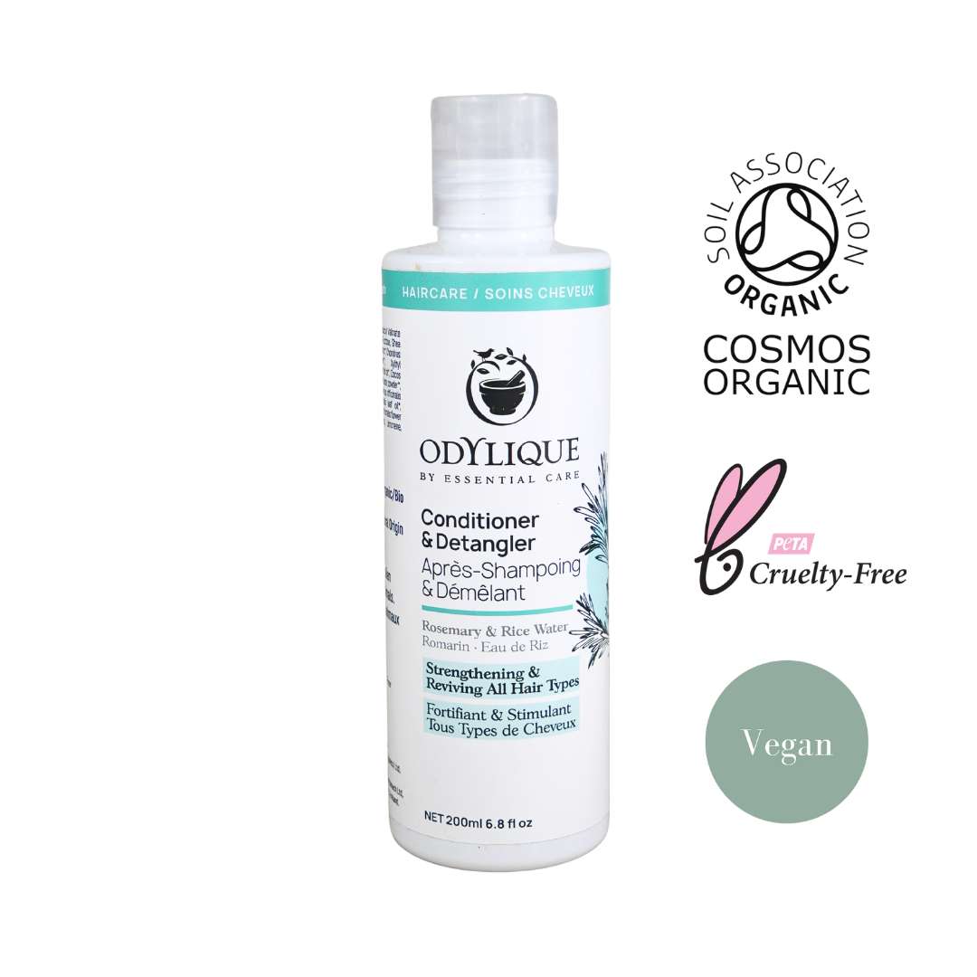 Odylique rosemary conditioner and detangler white plastic bottle with icons next to it stating it's organically certified, certified cruelty free and vegan friendly