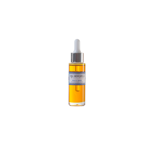 Casa Mencarelli Sole E Mare Sea Buckthorn Serum. Vegan face massage oil. The orange serum is packaged in a clear glass bottle with a label decorated with illustrations of traditional tiling from Umbria in Italy.