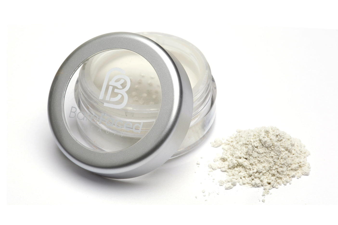 BareFaced Beauty Natural Finishing Powder in Ice. Ethical mineral makeup. The powder mineral foundation is pictured in a clear plastic jar with a small pile of the powder sitting next to it.