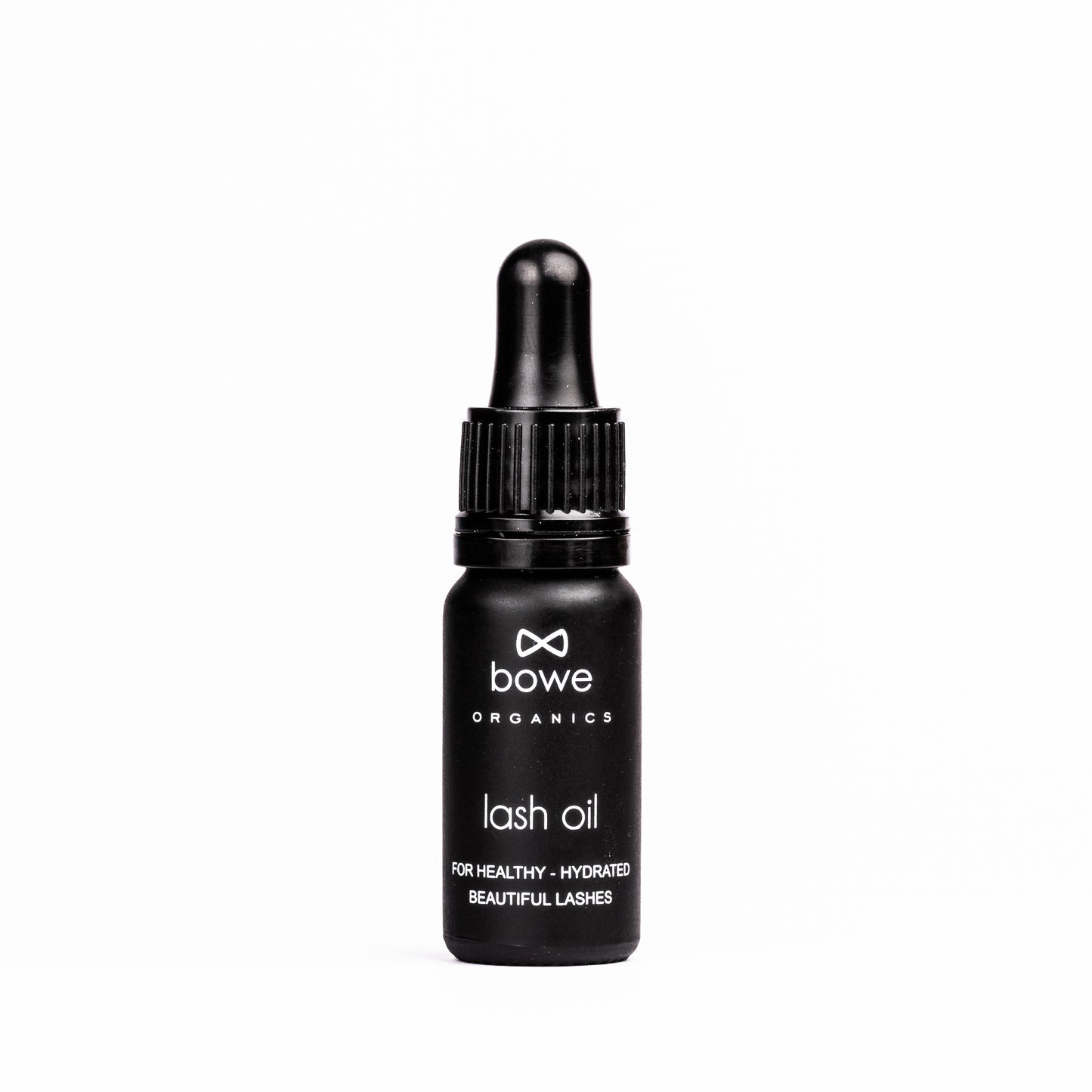 Bowe Organics Lash Oil photographed on a white background. the vegan lash treatment oil is in a matt black glass bottle with a black rubber and plastic pipette. the label reads 'bowe organics lash oil for healthy, hydrated beautiful lashes'
