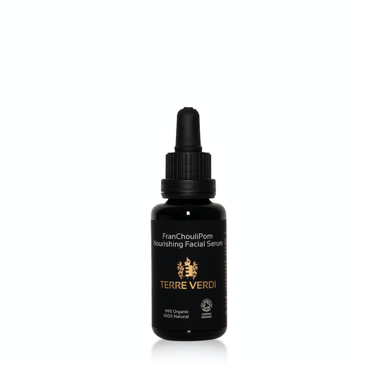 Terre Verdi FranChouliPom Nourishing Facial Serum. Certified organic face oil. Dry skincare. In a black glass bottle with a black plastic pipette. It is labelled in black with the gold logo in the centre and all other text in white.