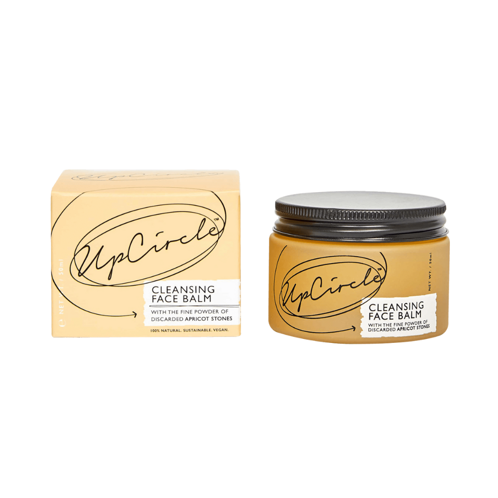 UpCircle Cleansing Face Balm. Sustainable skincare. The orange glass jar containing the balm is sitting next to the branded orange box it comes in.