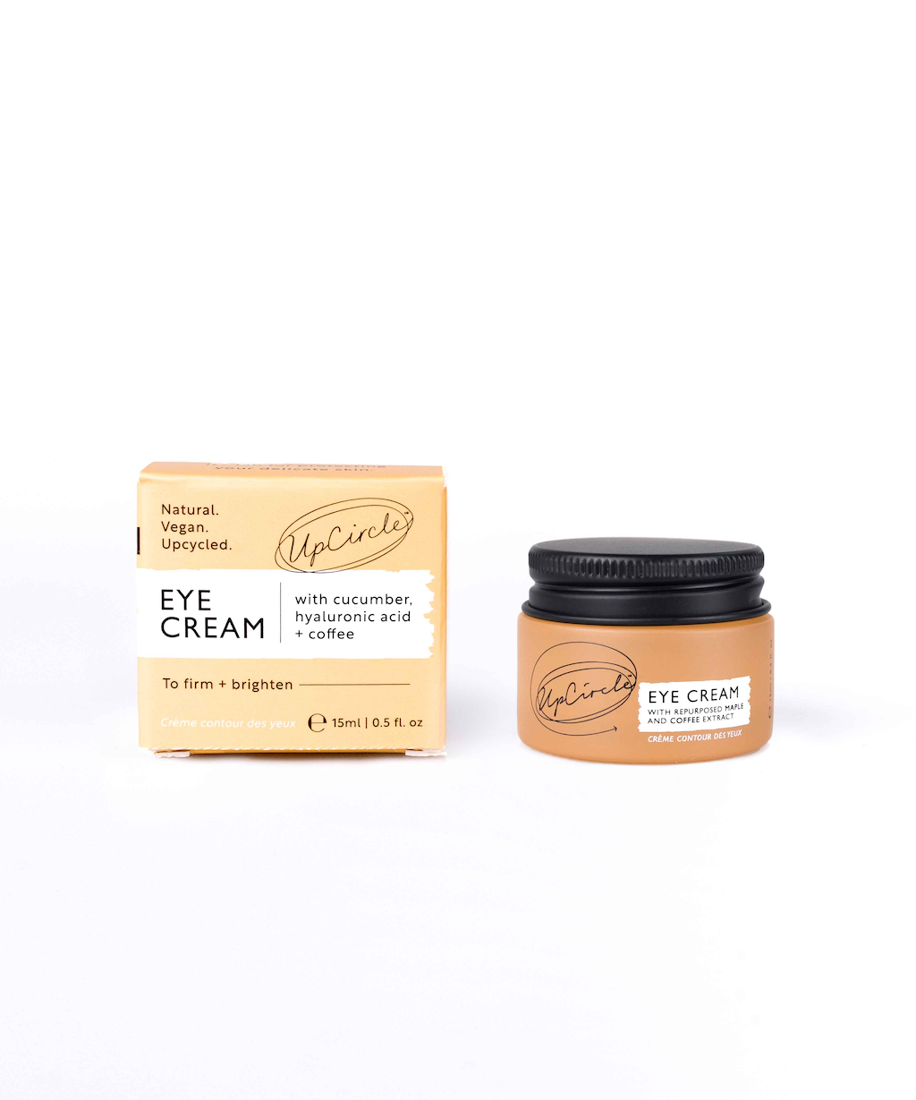 UpCircle Eye Cream. Cruelty free eye cream. The orange jar is sitting next to the orange branded box.