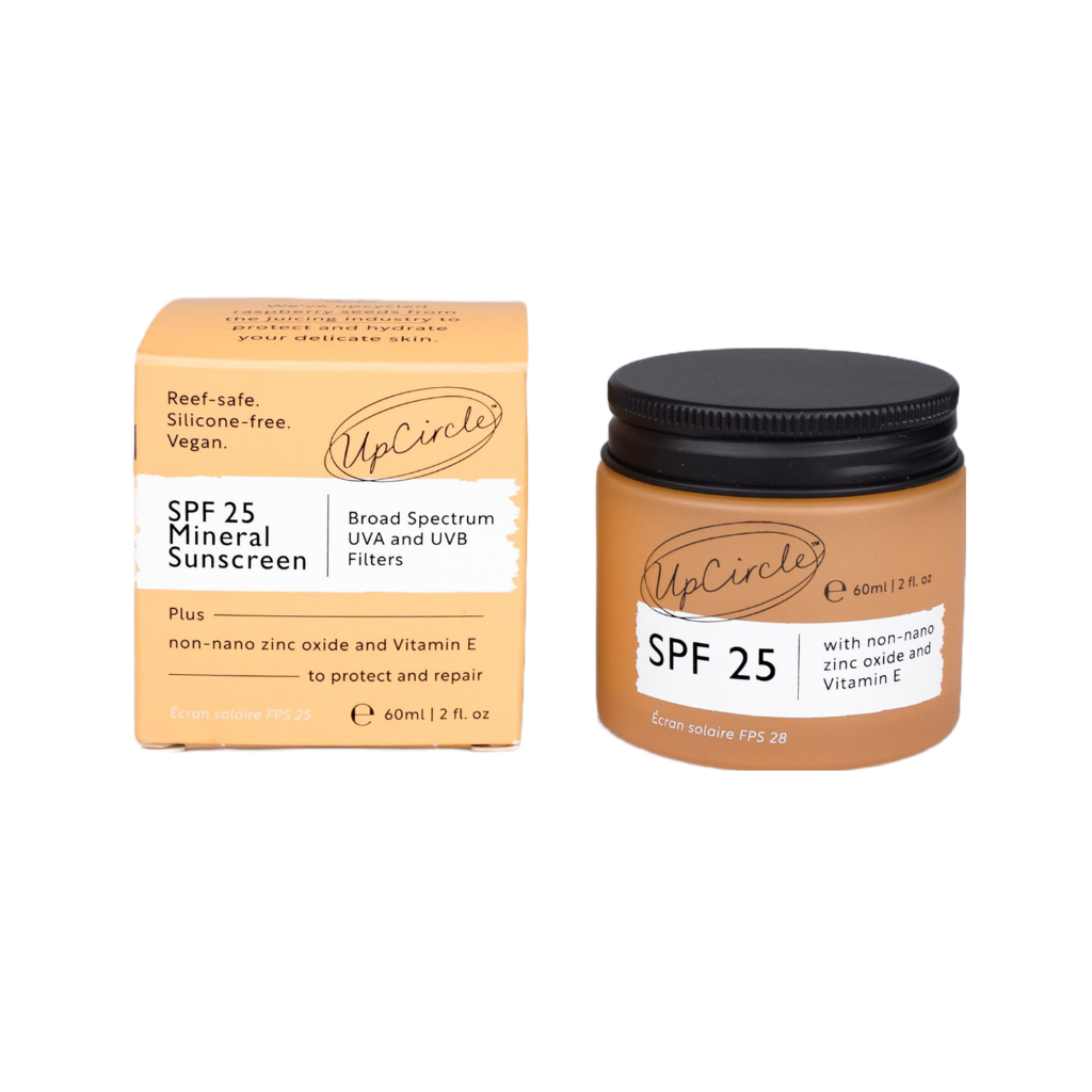Image of a jar and box of UpCircle SPF 25 Mineral Sunscreen. The box has text that reads, "Reef-safe. Silicone-free. Vegan. SPF 25 Mineral Sunscreen. Broad Spectrum UVA and UVB Filters." The jar and box indicate the product contains non-nano zinc oxide and Vitamin E.