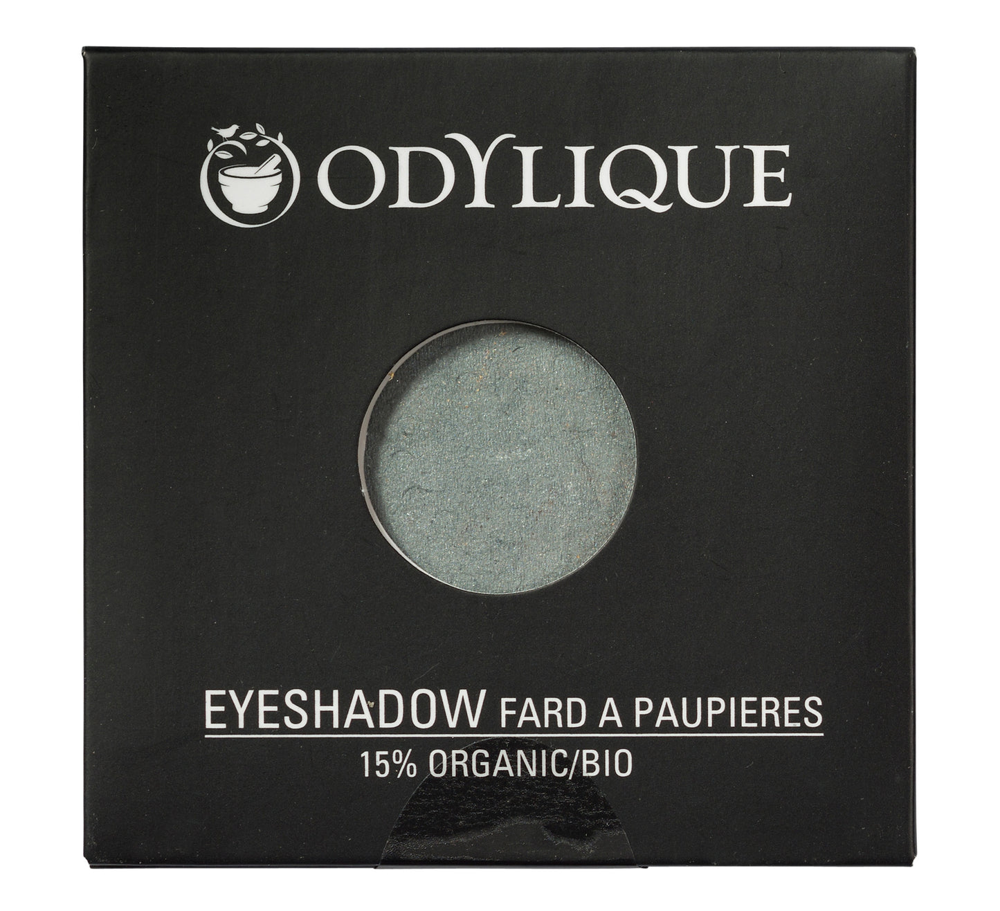 Single pan Odylique organic eyeshadow in shade Lagoon, placed in its black packaging.