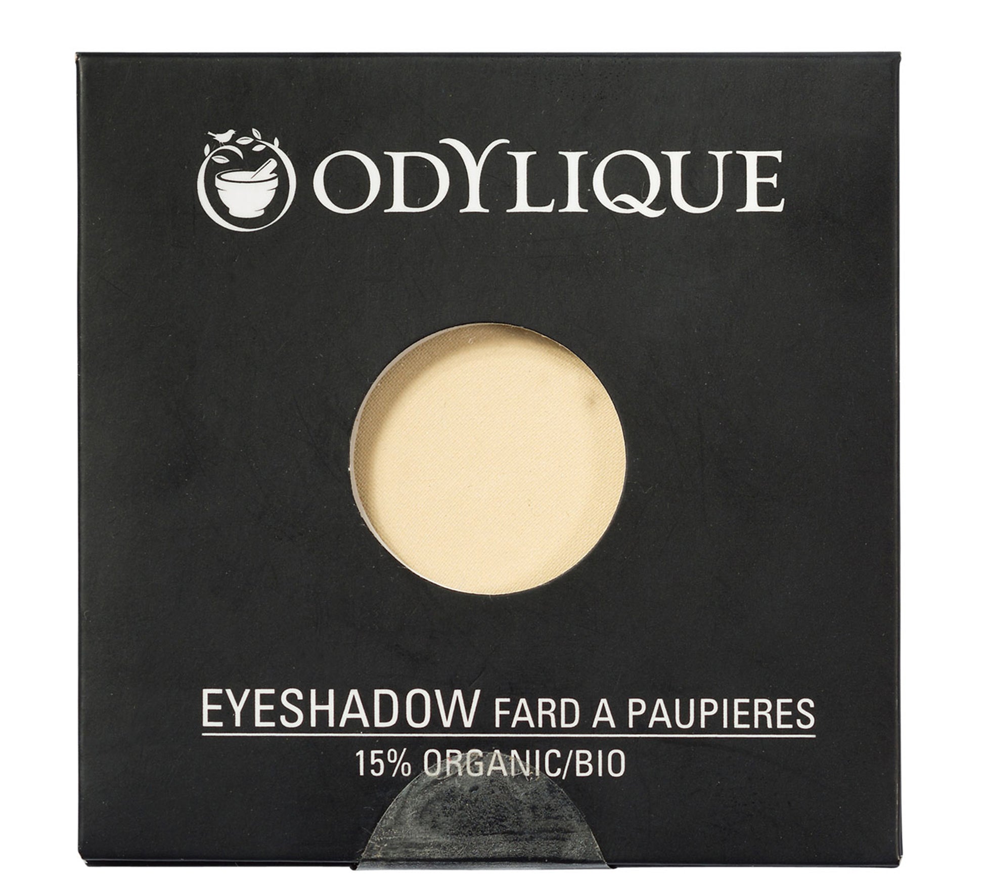 Single pan Odylique organic eyeshadow in shade Sand, placed in its black packaging.