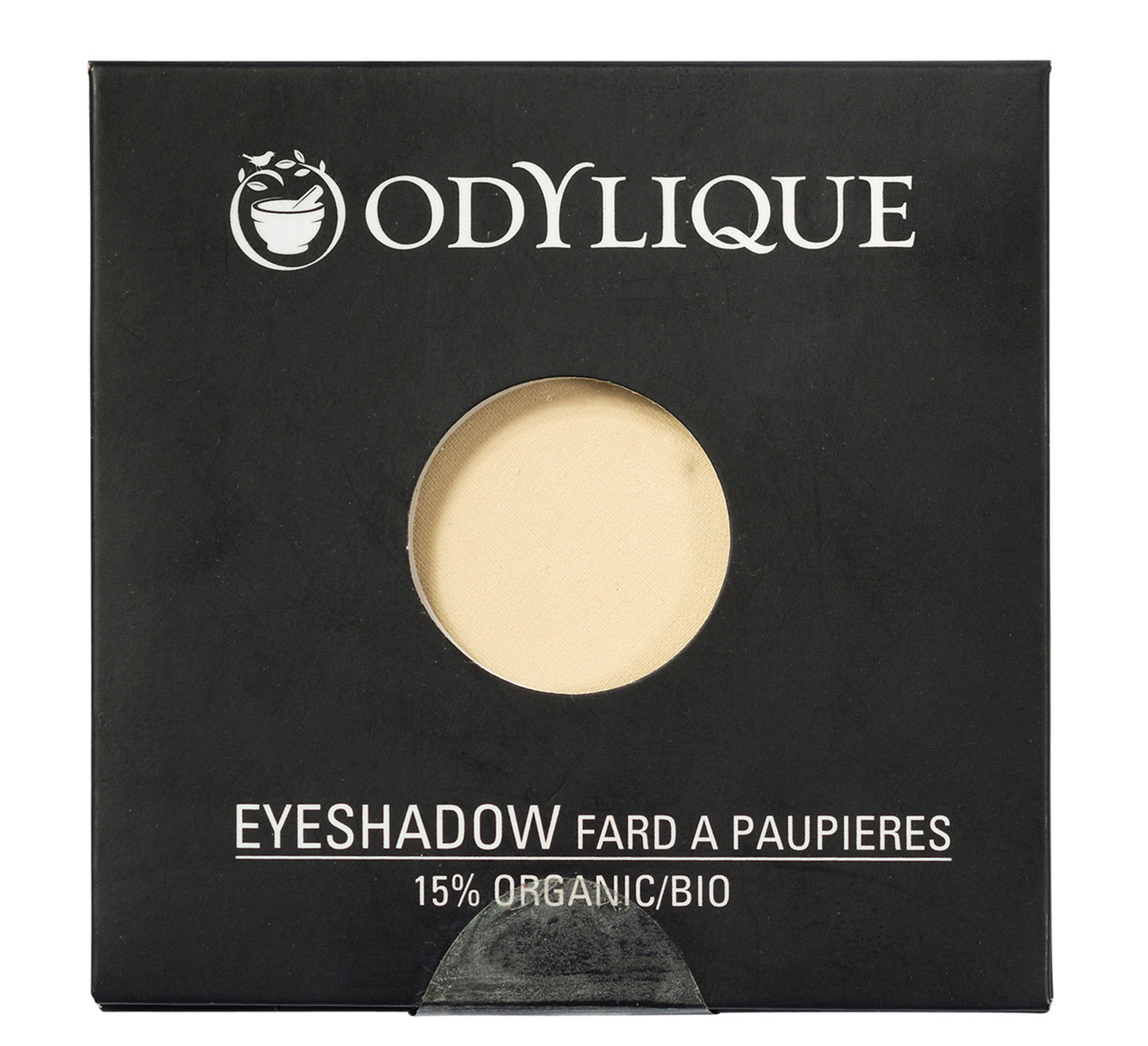 Single pan Odylique organic eyeshadow in shade Sand, placed in its black packaging.