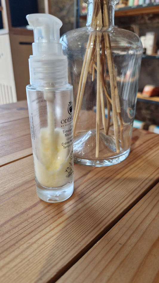 glass bottle with face moisturiser that's separated in the heat