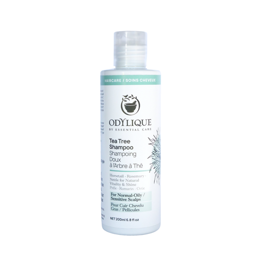 Odylique Tea Tree Shampoo bottle on a white background