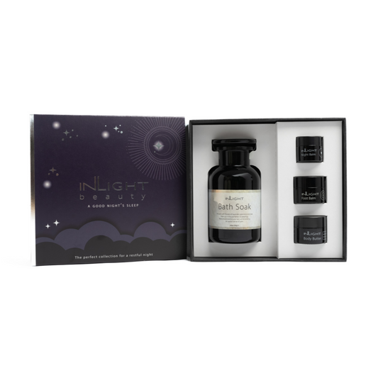 inlight beauty good night's sleep gift set in a purple sleeve and black and white gift box containing a full size bath soak and 3 miniature body skincare products