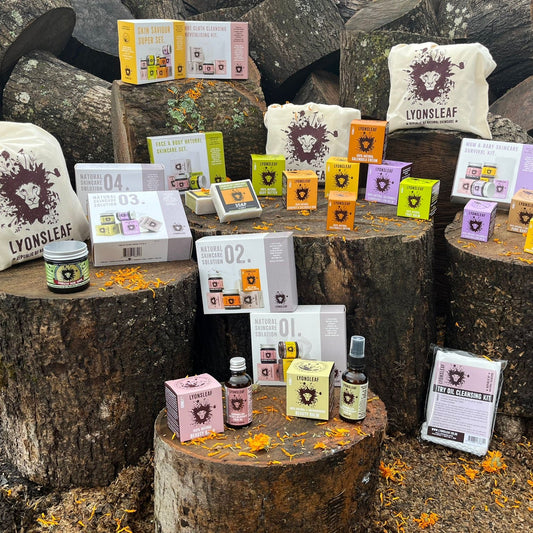 Lyonsleaf products displayed on wooden logs outdoors