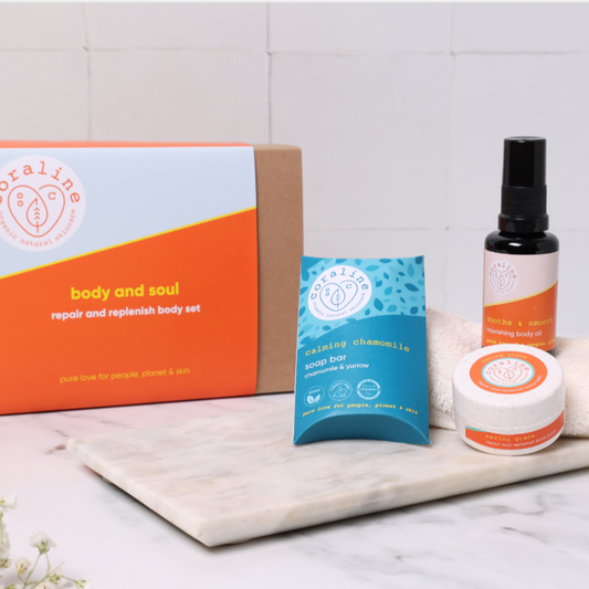 brow kraft gift box with orange sleeve sat next to 3 bodycare products made from natural ingredients for sensitive skin