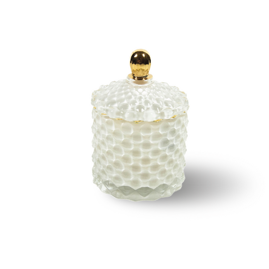 Bowe organics candle, pictured on a white background is a soy candle, in a white textured glass with a white textured glass lid and a gold handle.