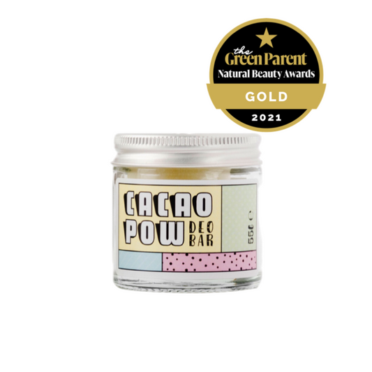 Photo of Cacao Pow natural deodorant bar in glass jar with aluminium lid and colourful label displaying product name. In the top right corner there is a logo for the green parent natural beauty awards 2021.