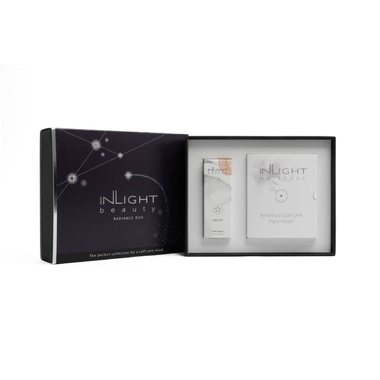 inlight beauty face oil and amethyst gua sha gift set in the base box with festive sleeve to the left