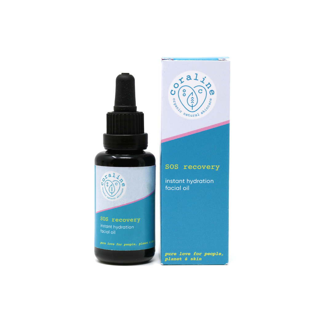 A dropper bottle of SOS Recovery Instant Hydration Facial Oil stands next to its box. The bottle is black, with a blue label and white logo. The box features a blue design with white branding text highlighting the instant hydration and natural ingredients.