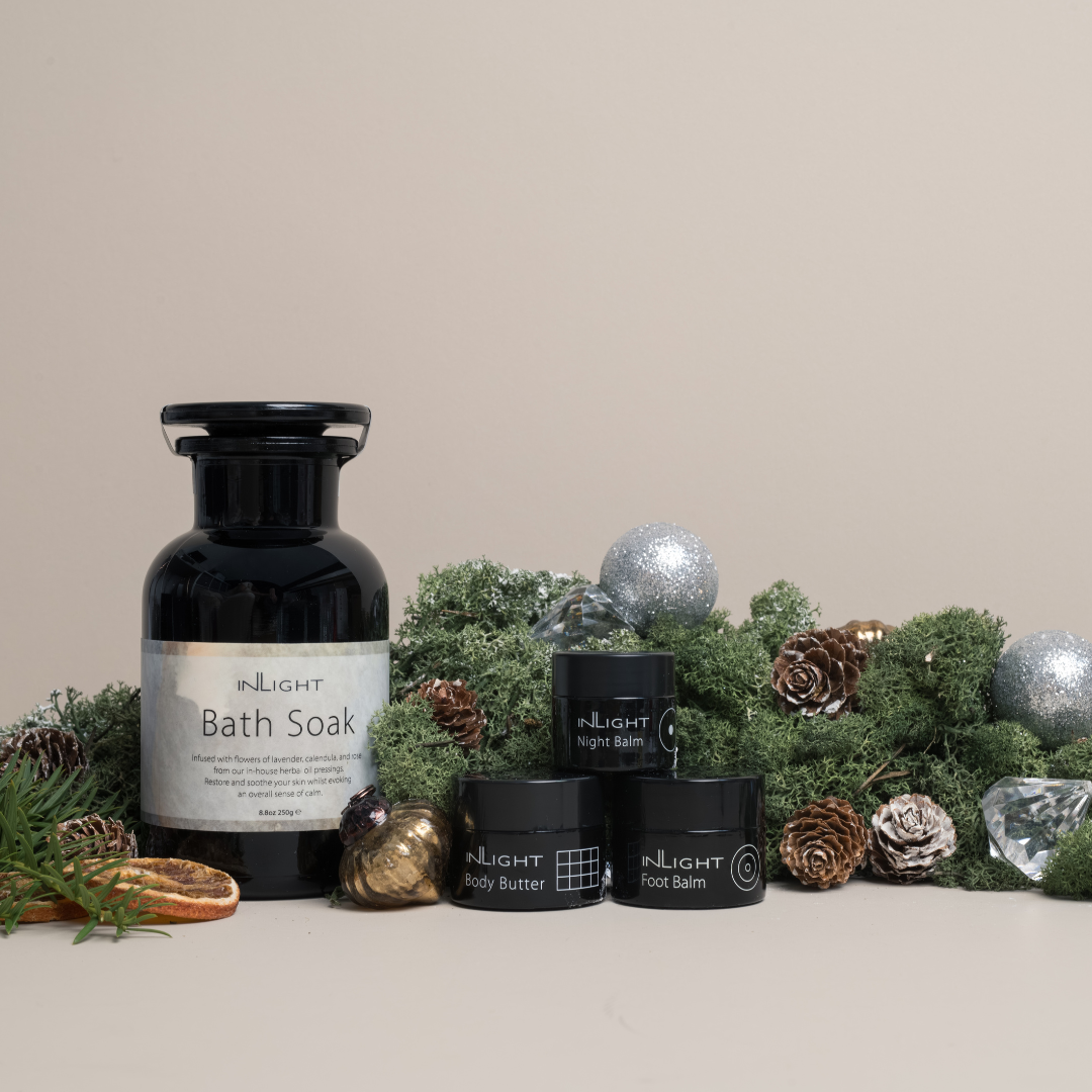 good nights sleep set out of the box and in a festive scene with green foliage and pine cones