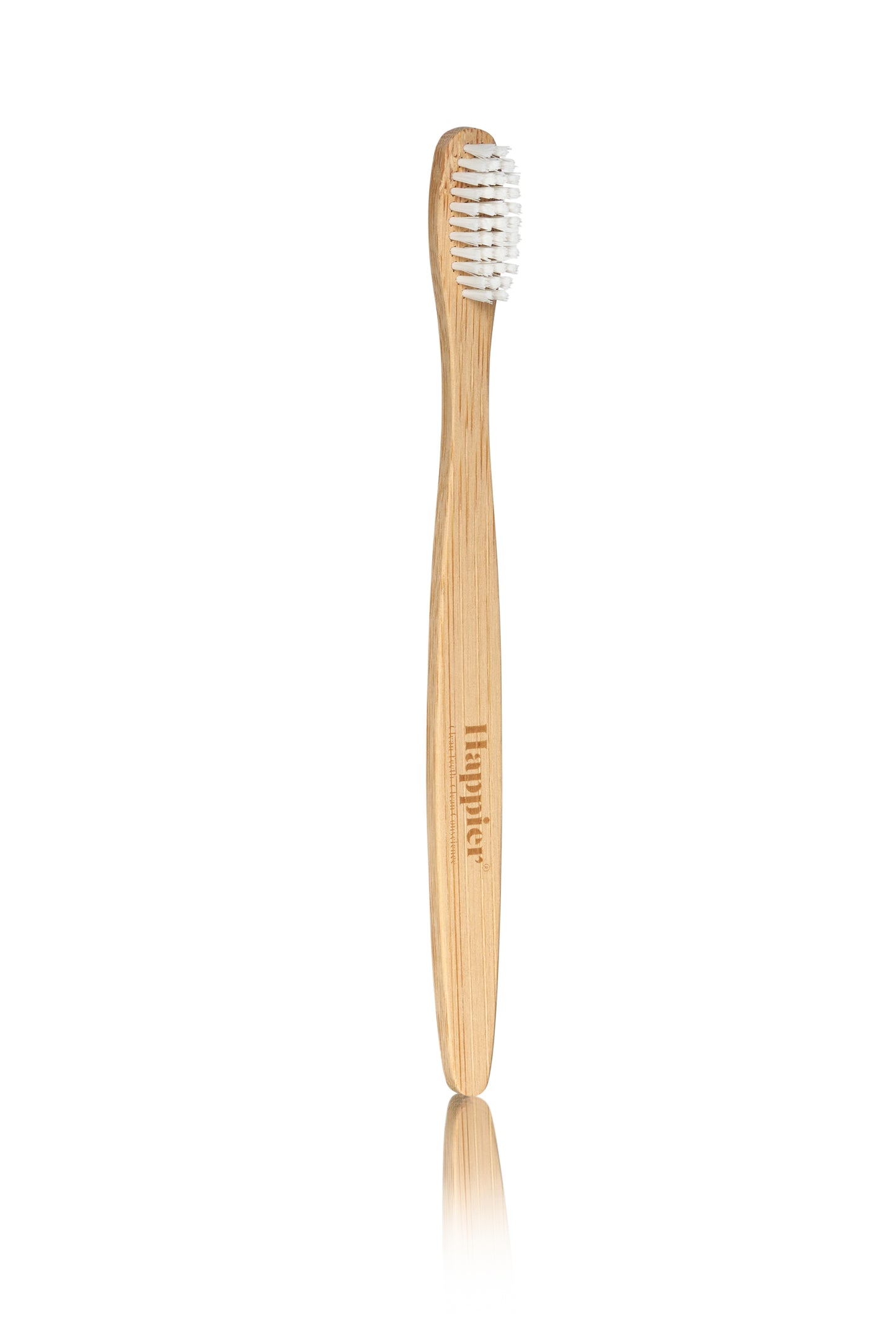 bamboo tooth brush with white bristles and happier beauty logo engraved in the wooden handle