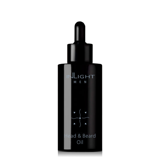 inlight beauty 100% organic head and beard oil in a black recycled miron glass bottle with pipette on a white background