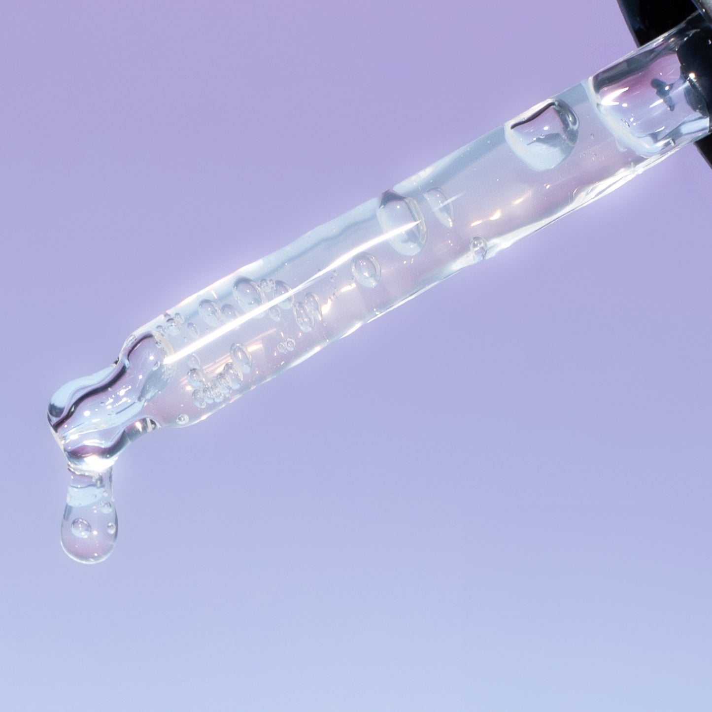 pippette dropper with upcircle peptide serum dripping out