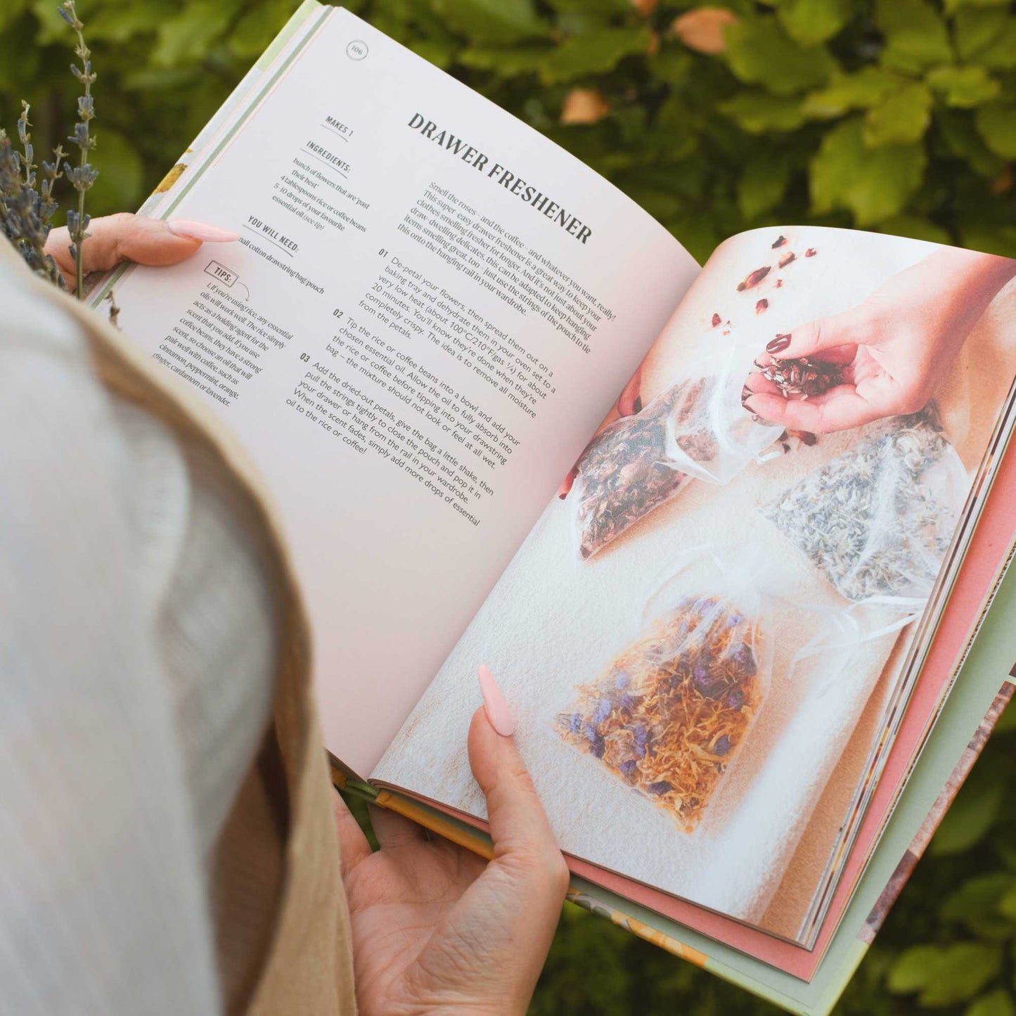 fair skinned person holding upcircle's skincare recipe book open on the page that shows you how to make drawer fresheners