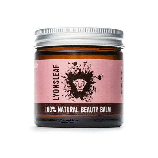 multipurpose skincare balm from lyonsleaf in a brown glass jar with silver aluminium lid and a dusky pink label with a lions mane graphic on it on a white background