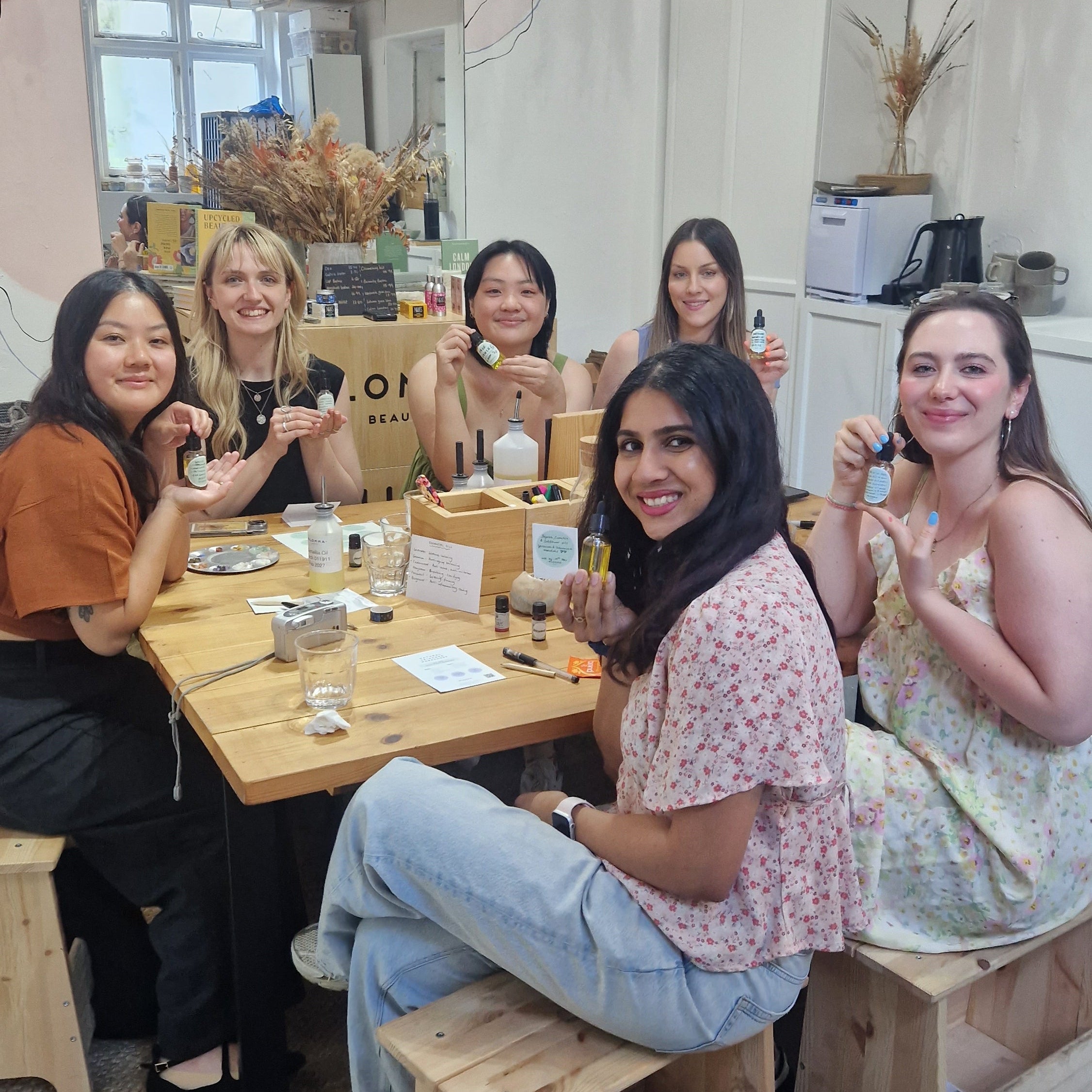 Guests at the Blomma Beauty workshop studio making their own natural face oils