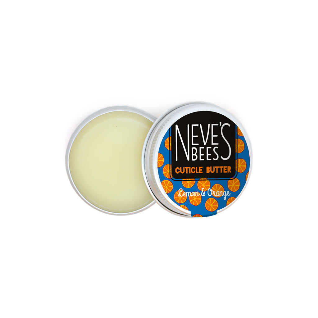 neves bees cuticle butter made with oxfordshire organic beeswax in an aluminium tin with a blue sticker and bright orange oranges on it with black orange and white text. The tin is open with the lid placed slightly over the base where inside you can see the creamy coloured cuticle butter within