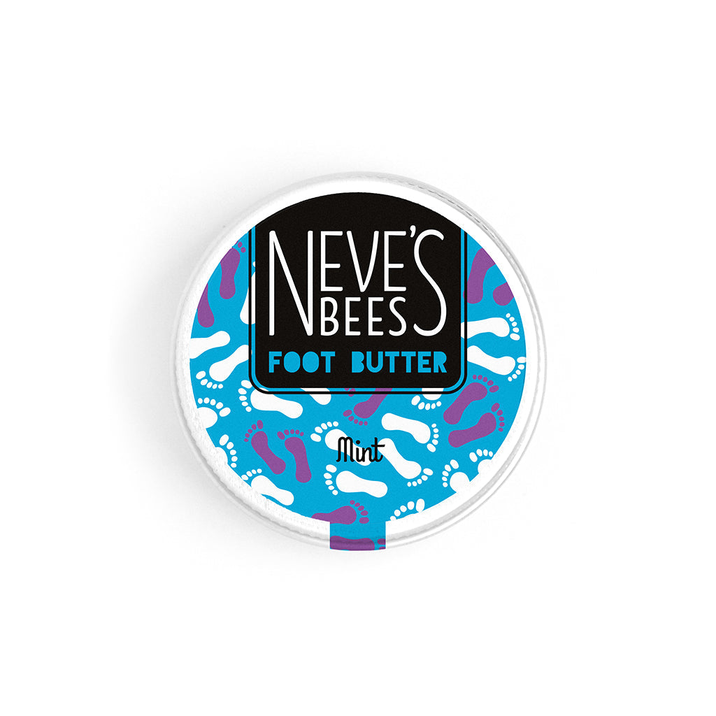 neve's bees foot butter photographed on a white background. the foot butter is in an aluminium tin which is seen here closed. looking from down on to the tin you can see the neve's bees logo and label on a bright blue background with white and purple outlines of feet