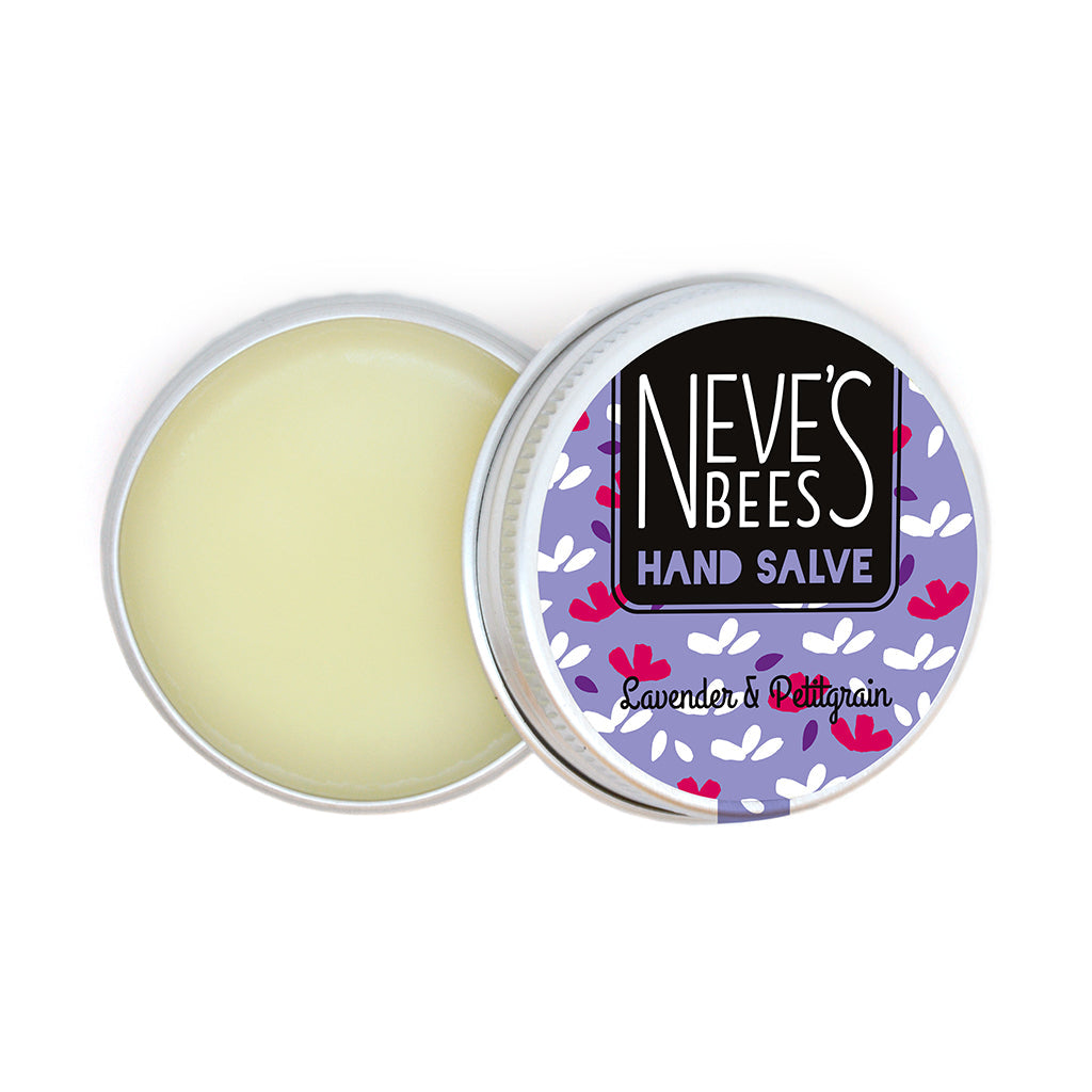 photo of neve's bees hand salve on a white background. the hand salve comes in an aluminium tin with a purple label on it that reads 'neve's bees hand salve lavender and pettigrain' there are graphics of flower buds in the background of the label. the tin is open and you can see the creamy coloured balm inside