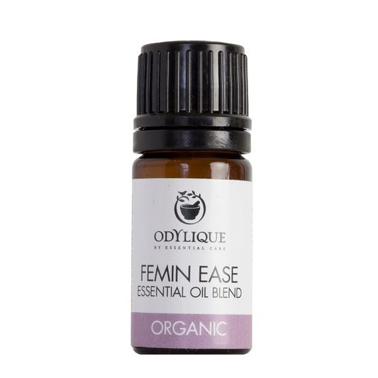 An amber glass dropper bottle of odylique Fein ease essential oil blend for easing pms, period pain and cramps
