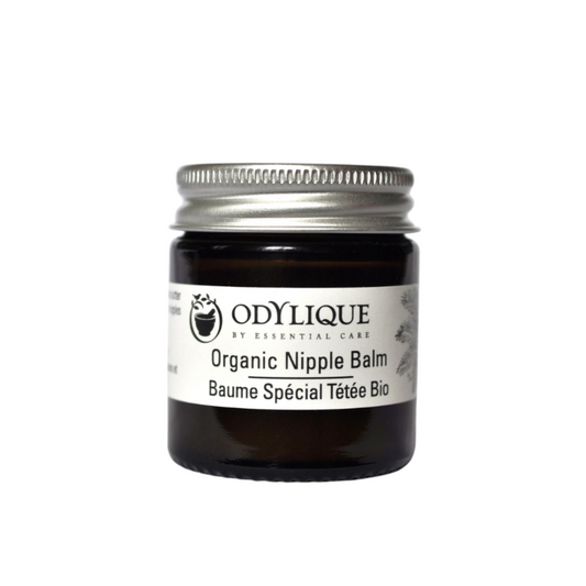 A small amber jar with a aluminium lid. It is labelled ‘Odylique organic Nipple balm’ and has a botanical illustration. the text includes english and french, emphasising organic essential care