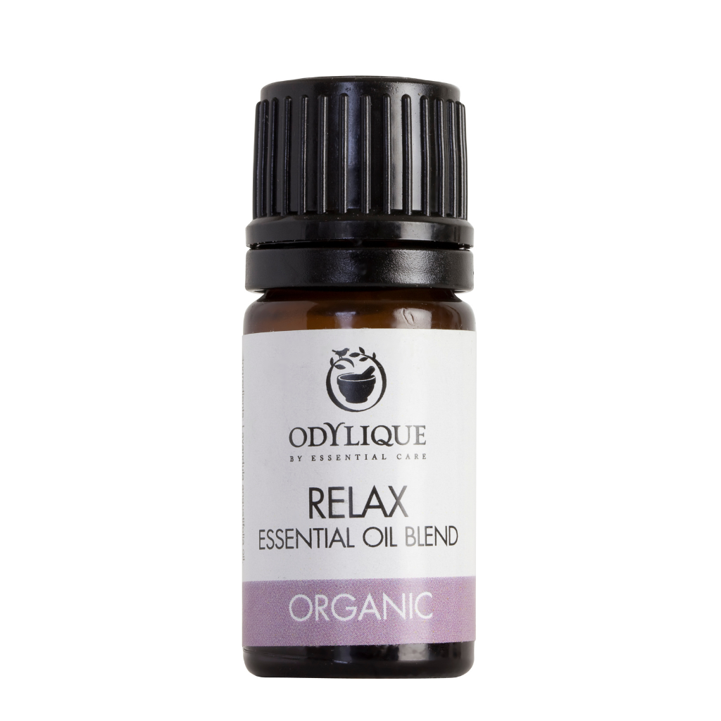 An amber glass dropper bottle of odylique relax essential oil blend